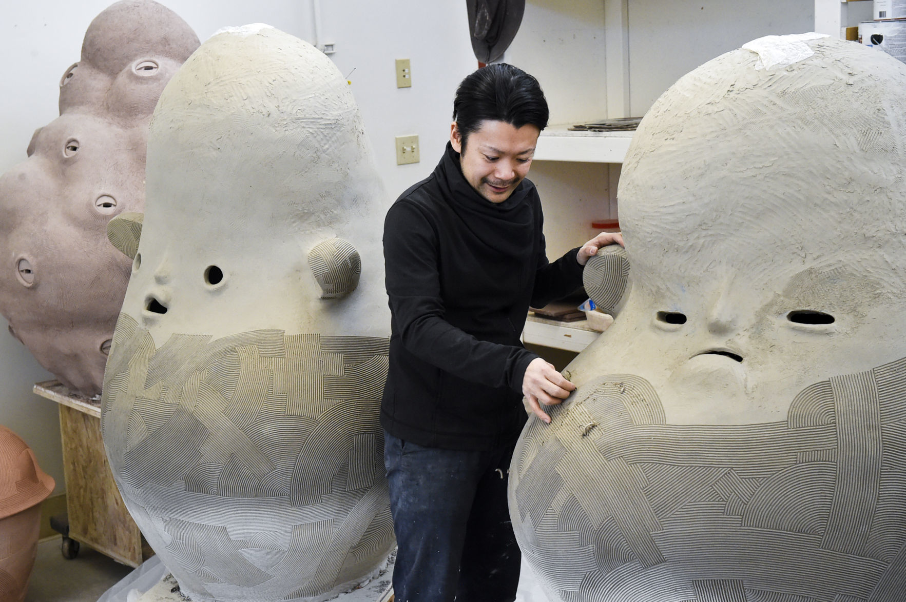 Archie Bray resident En Iwamura works on a piece Thursday in preperation for The National Council on Education for the Ceramic Arts conference in Pittsburgh next month.